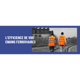 Deux agents FERELIS en gilet orange fluo marchent sur une voie ferrée, illustrant l’engagement pour l’efficacité des engins ferroviaires.